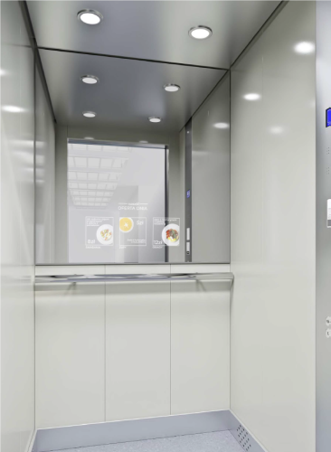 kabina z lustrem wyświetlającym treści reklamowe.png